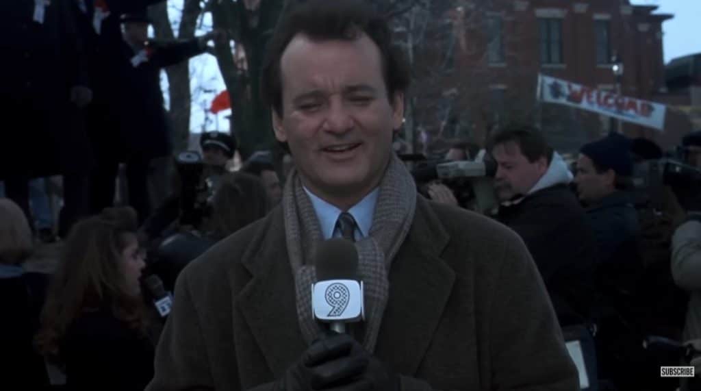 A picture of a reporter in the movie.
