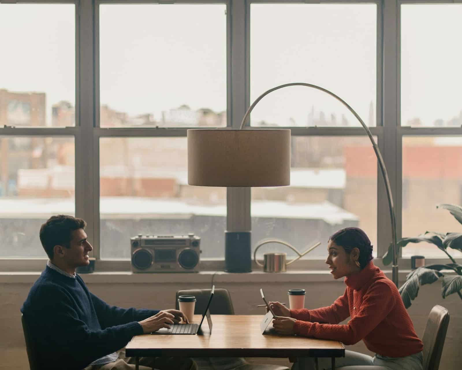 A man and woman having a coffee in the morning.