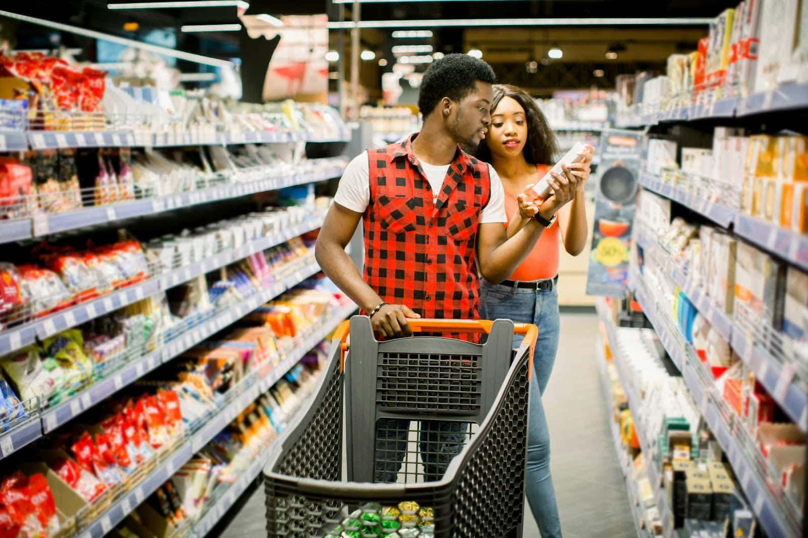A man and woman at the grocery store.