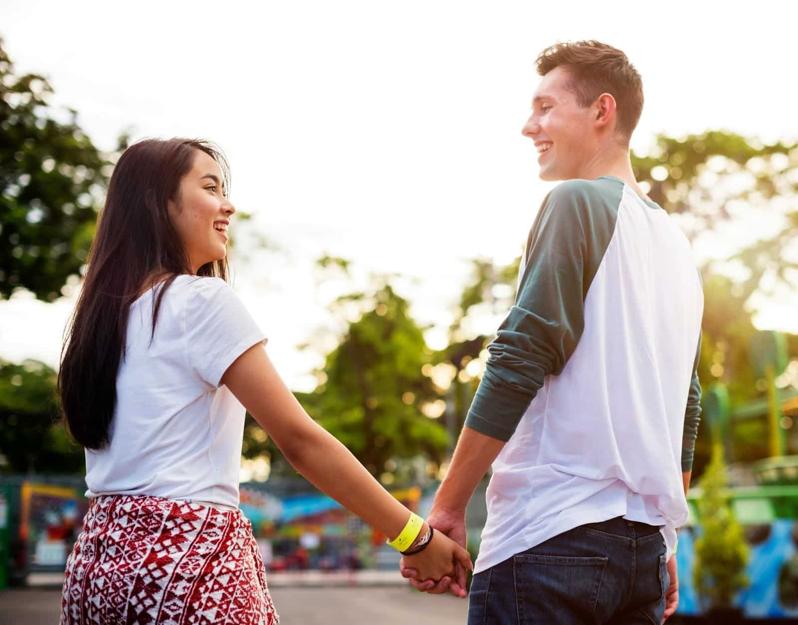 A man and woman holding hands.