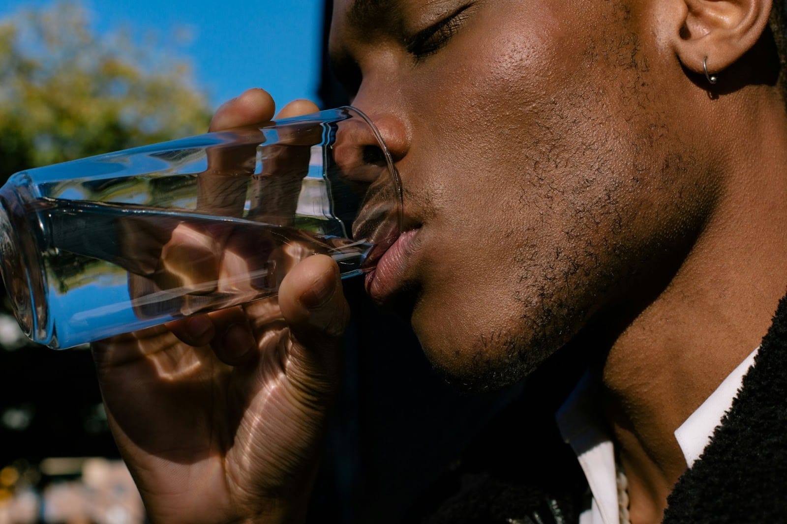 A man drinking a water.