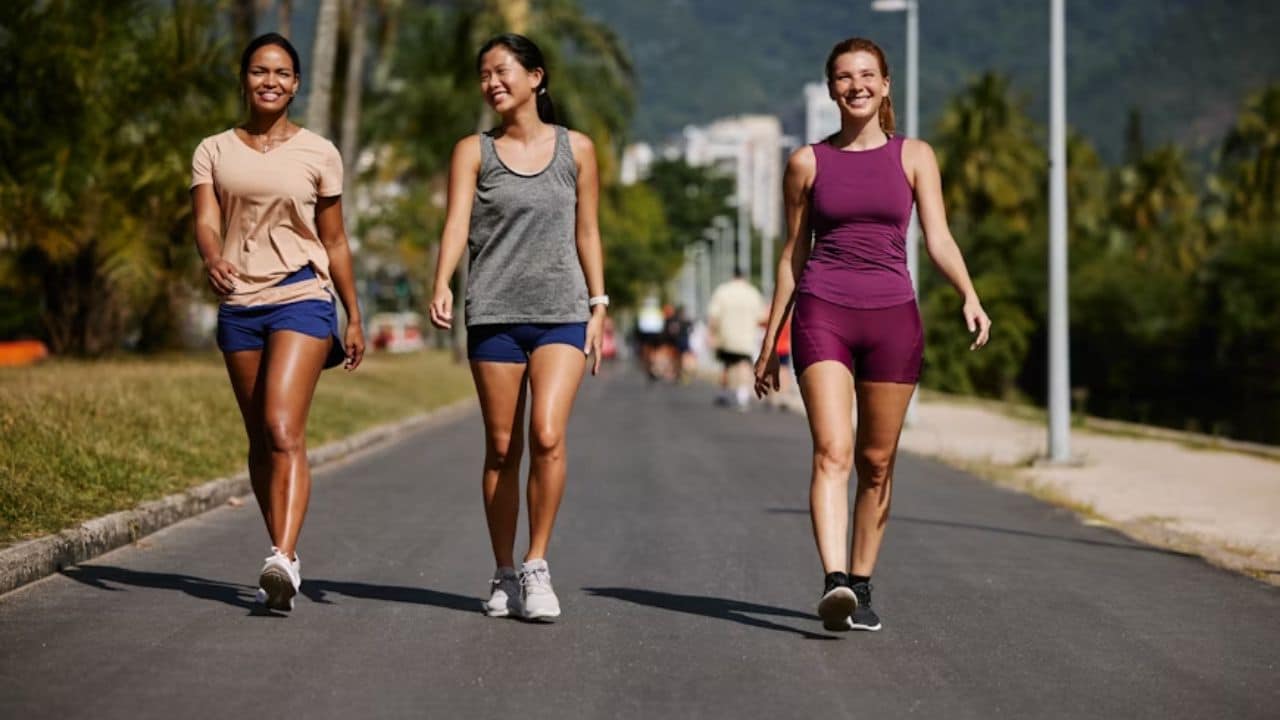 Three friends walking on the street.