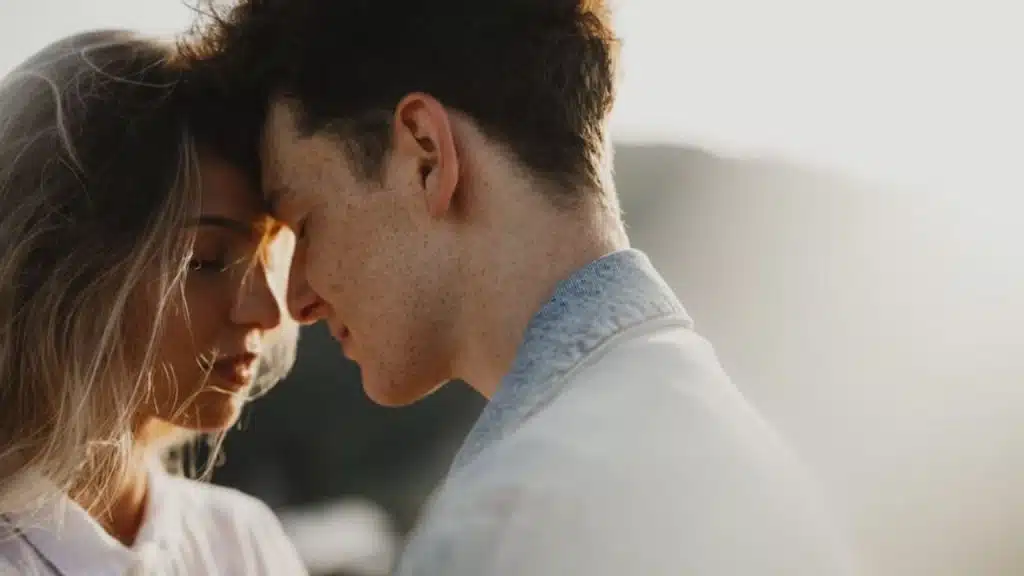 Young couple on a walk in nature at sunset