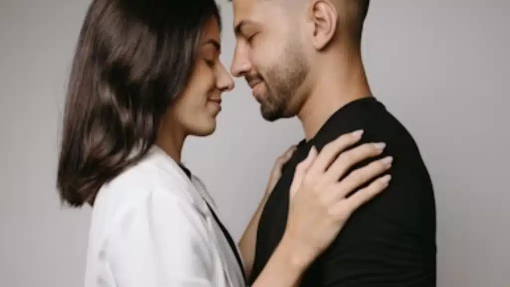 Man and a woman embracing each other.