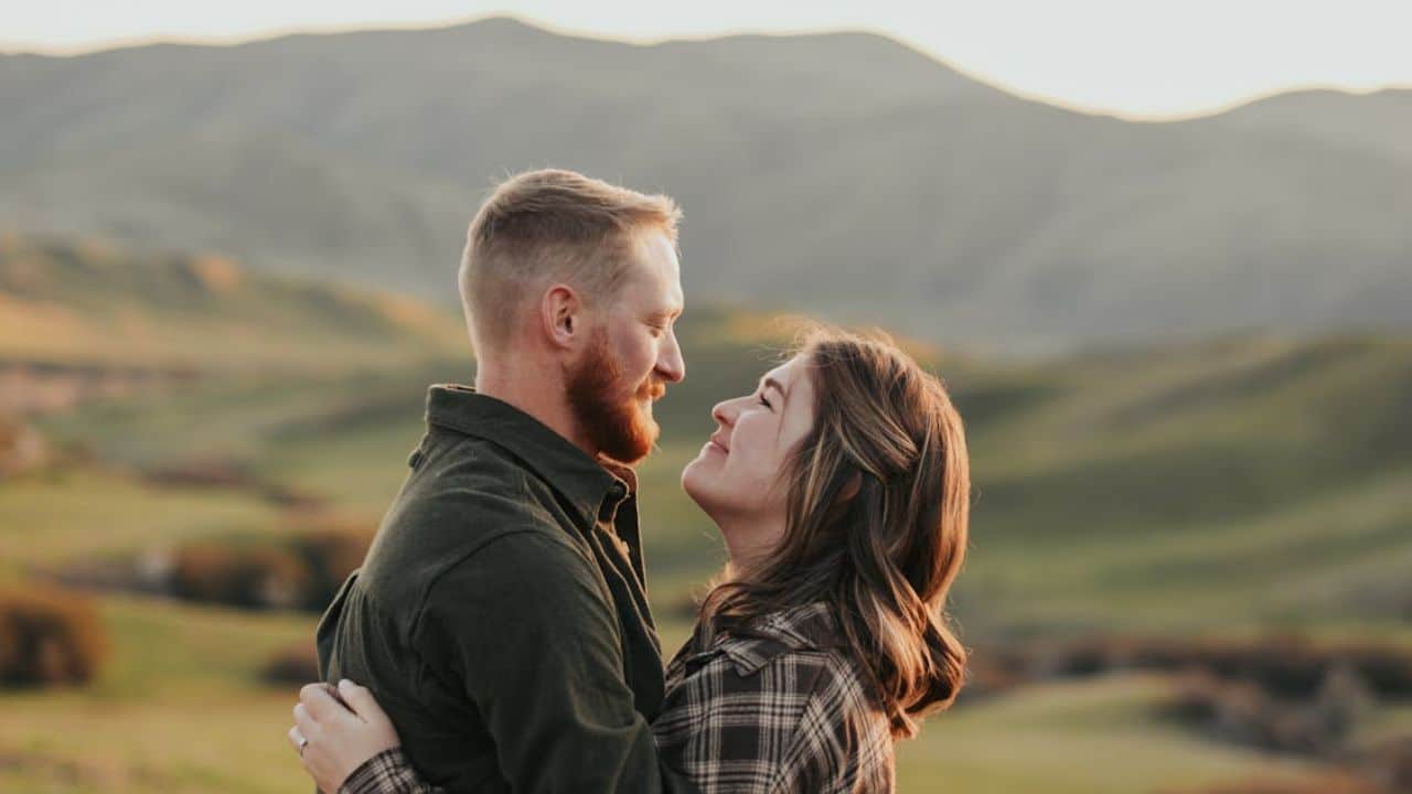 Couple holding each other and looking in the eyes.