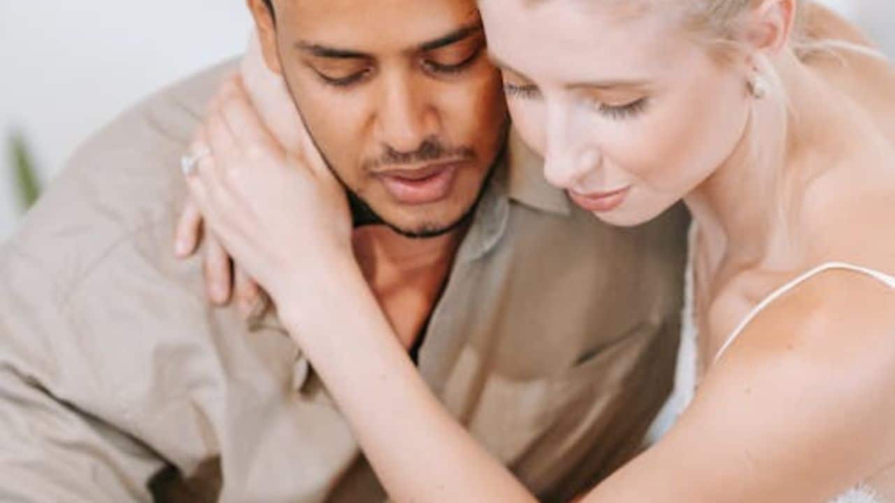 A man and a woman supporting each other.