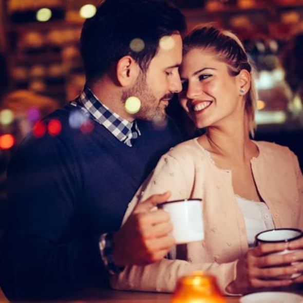 Man giving a woman her favorite coffee, showing attentiveness and care.