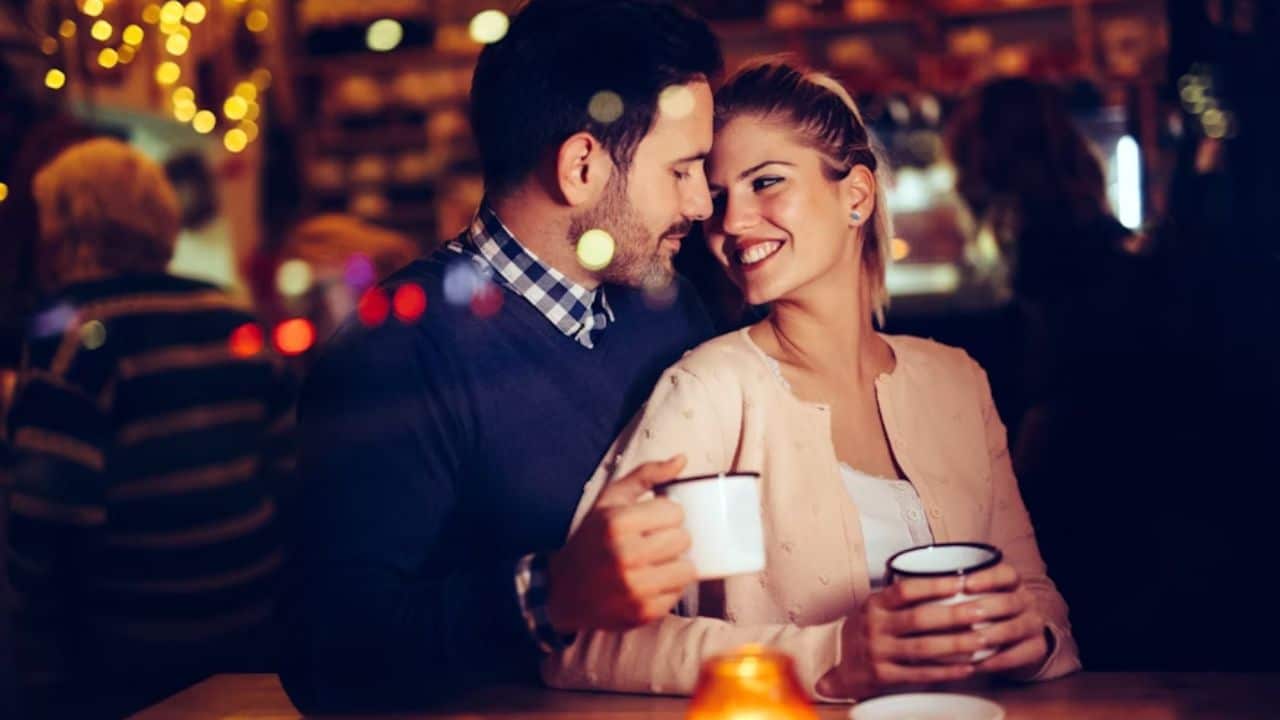 Man giving a woman her favorite coffee, showing attentiveness and care.