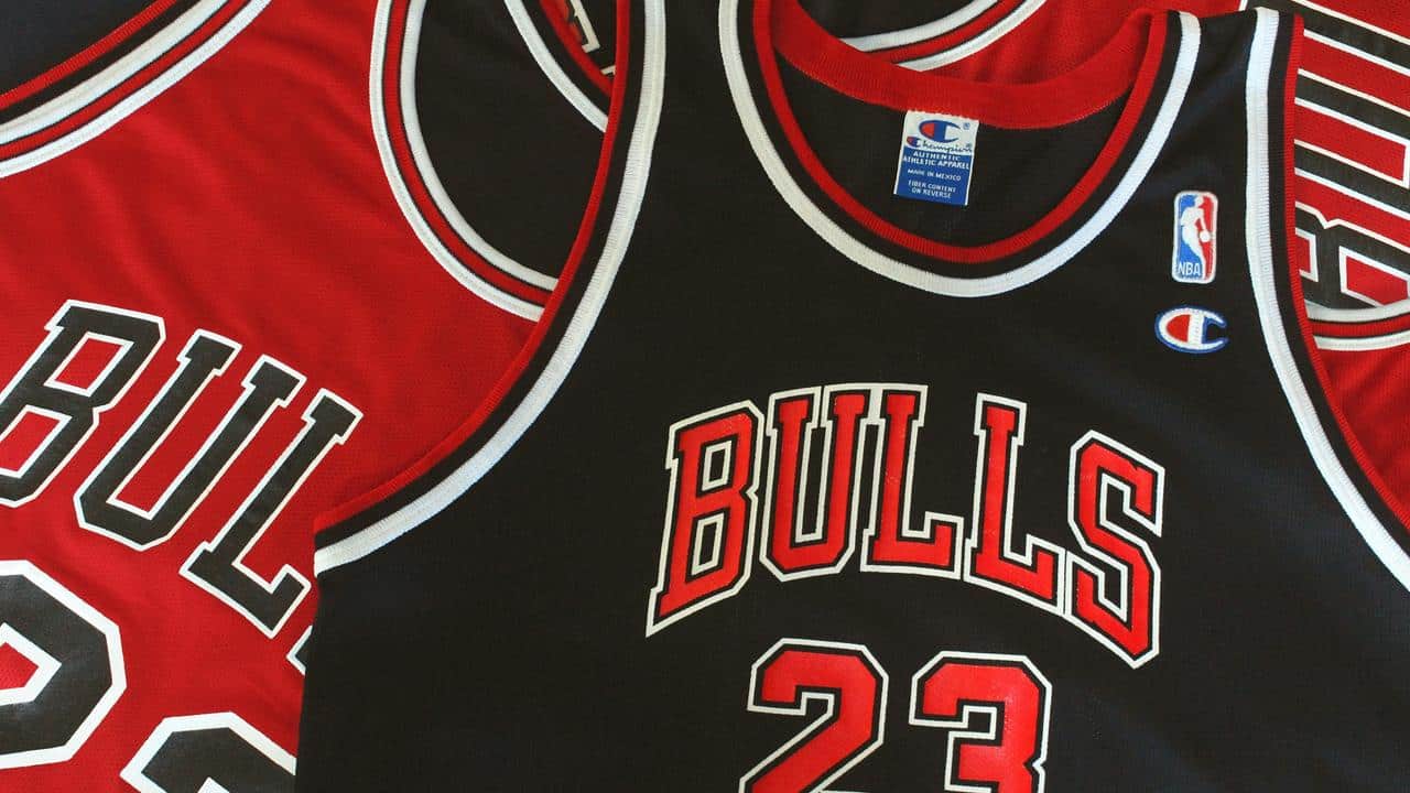 A close-up of Chicago Bulls jerseys, including a black number 23 jersey.