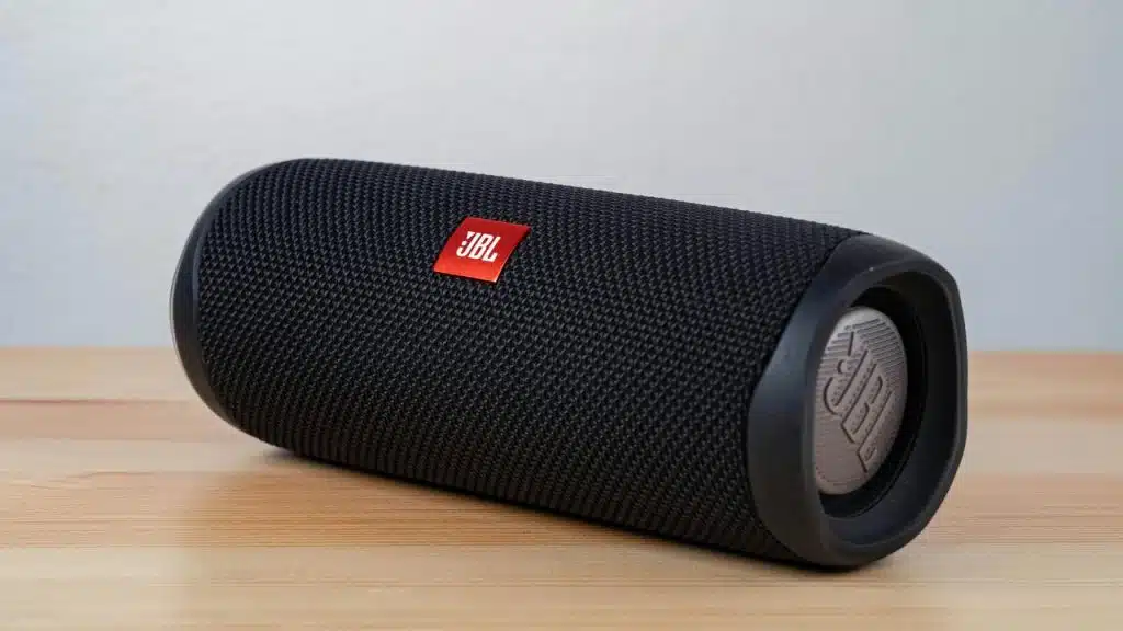 A black portable speaker on a table.