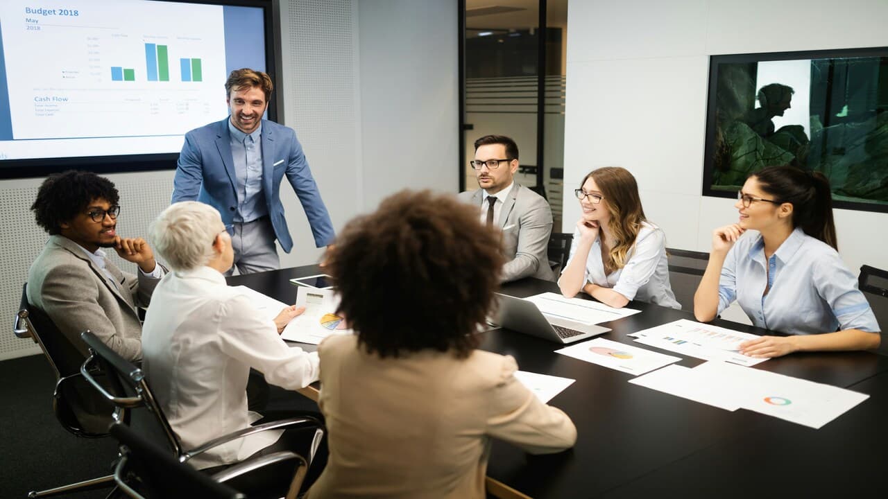 A man leading a business meeting.