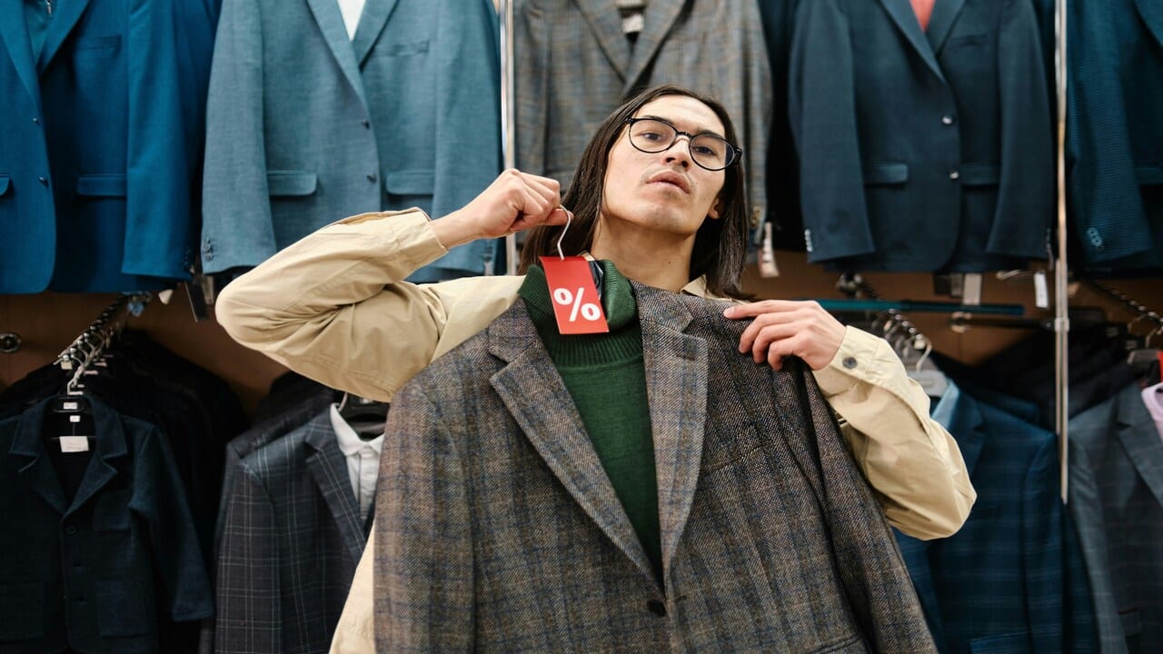 A man trying on clothes.