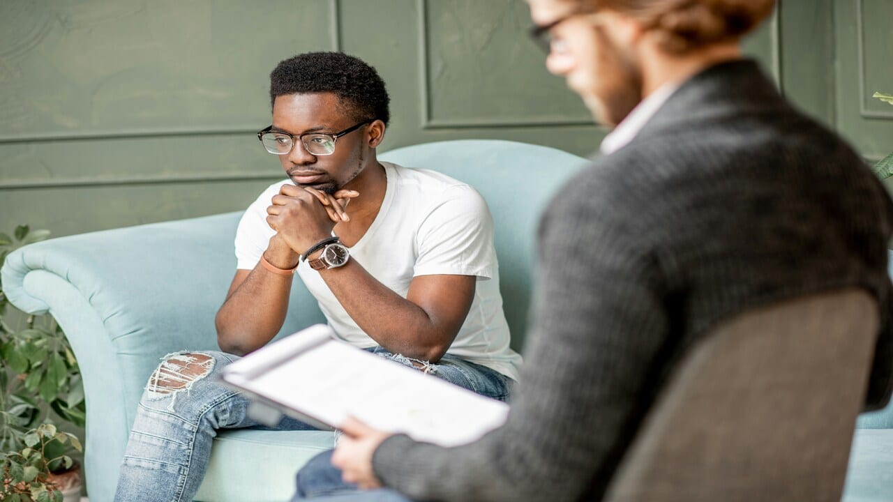 A man in a therapy session.