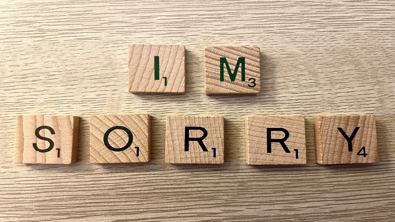 Wooden letters spelling out “I’m sorry”.