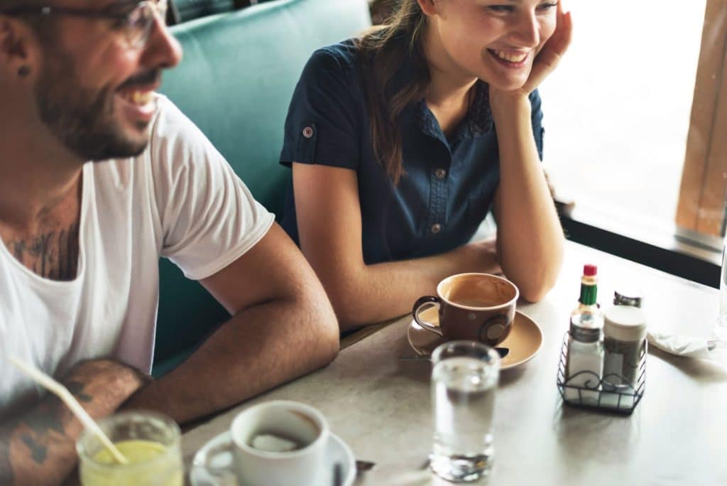 A man and woman happy at the restaurant 