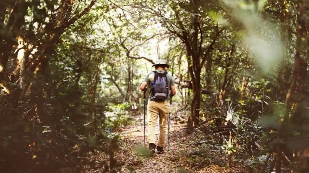  Man walking alone with purpose, symbolizing self-led confidence.