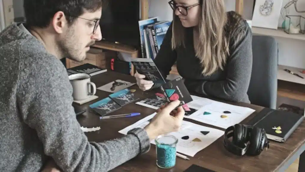 Man and woman collaborating, showing partnership not rivalry.
