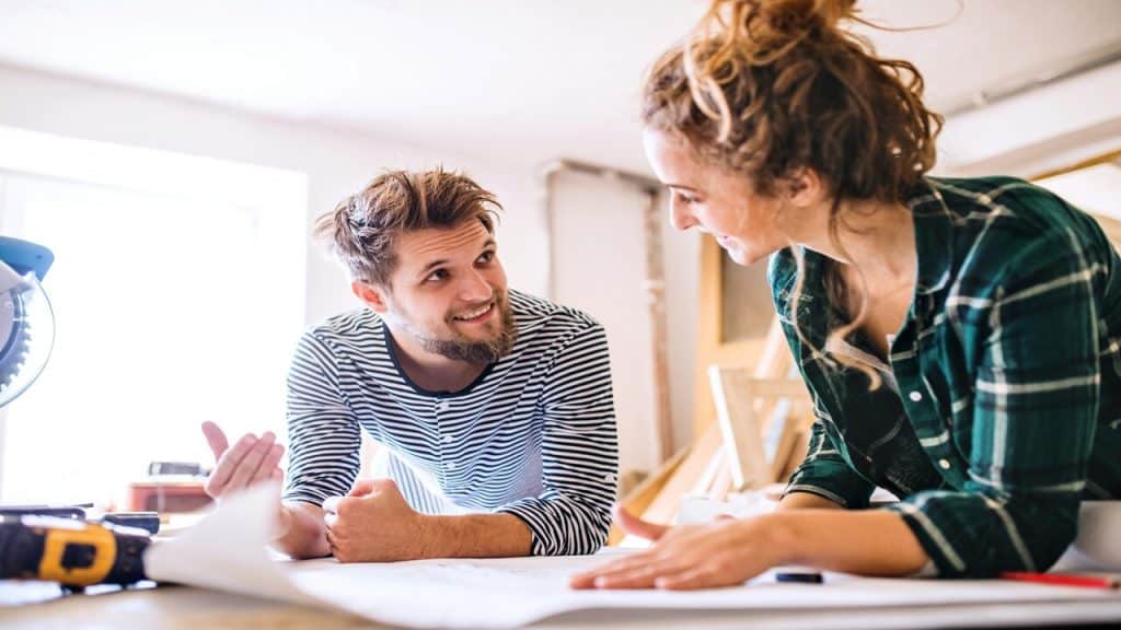 A couple working on their home together.
