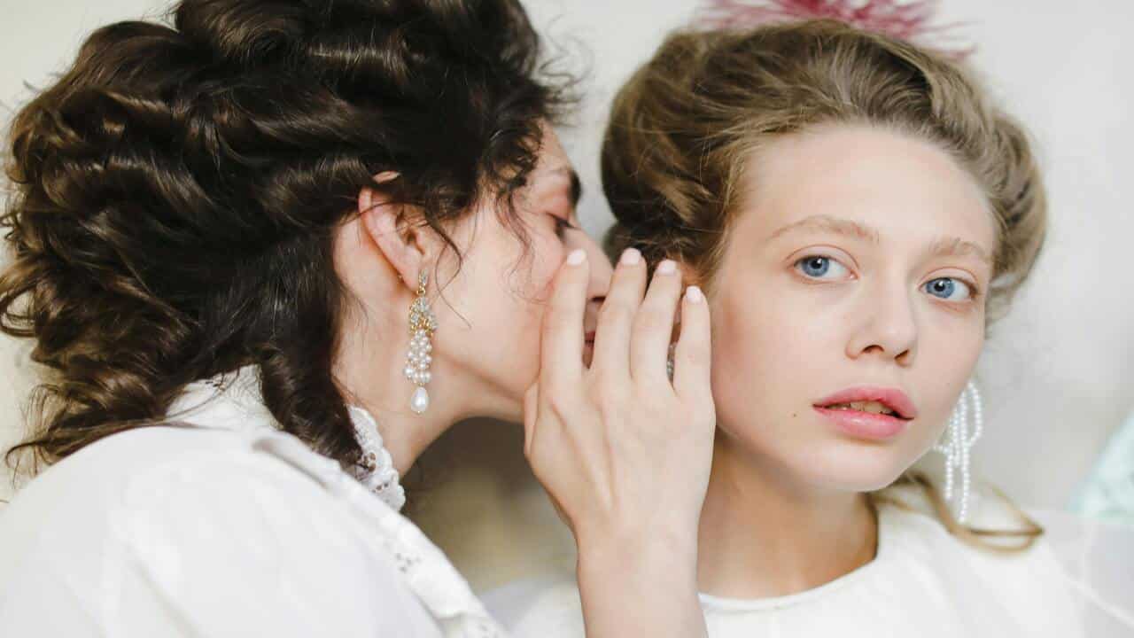 Women gossiping about other people.