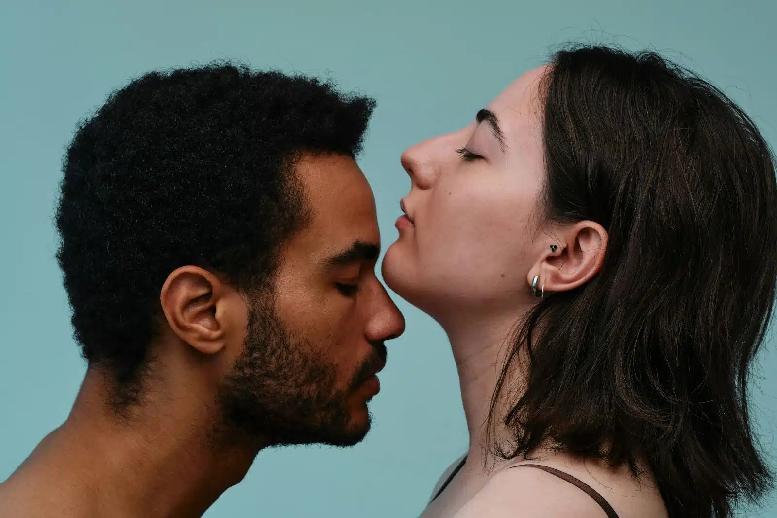 A man and woman facing each other.