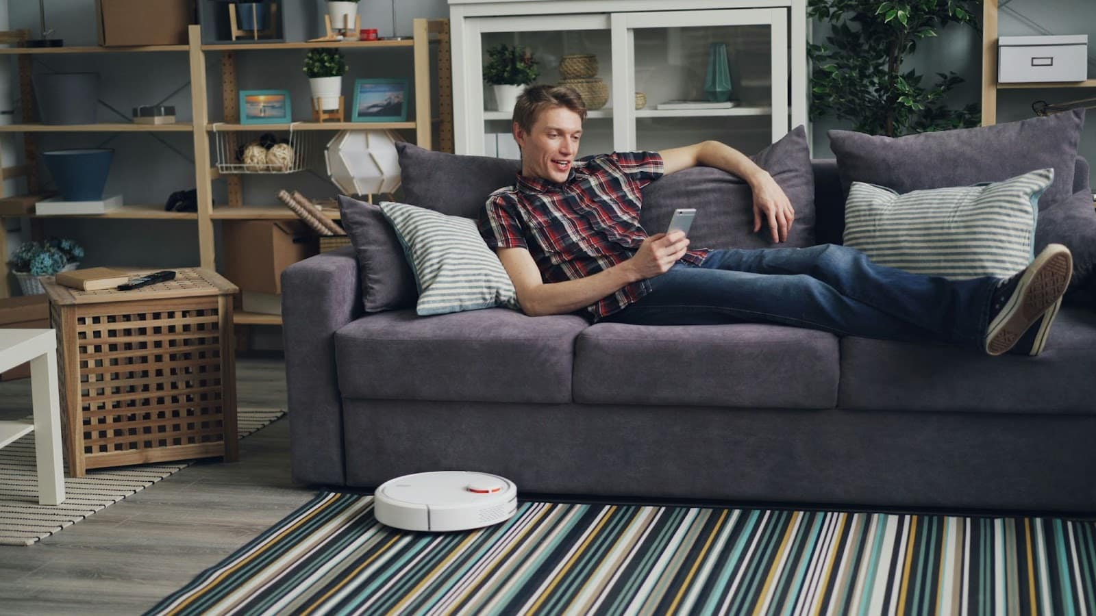 A man chilling at the sofa alone.