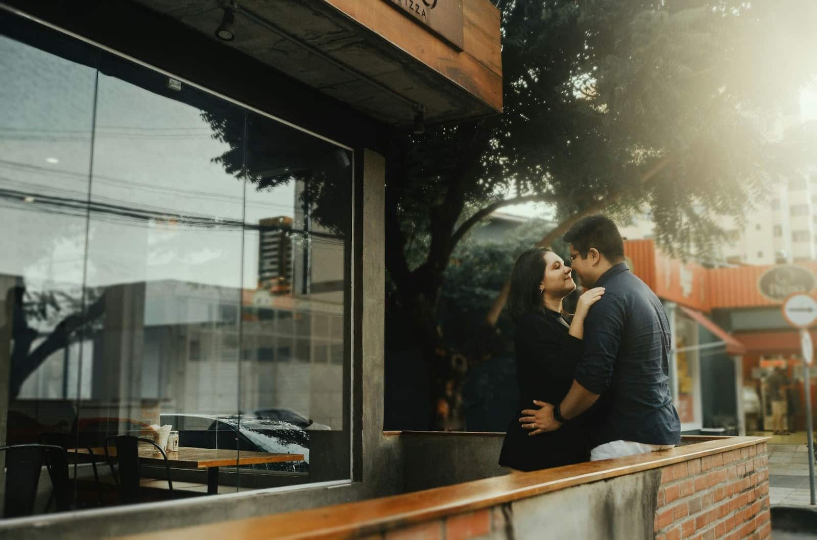 A picture of a man and woman at the balcony.