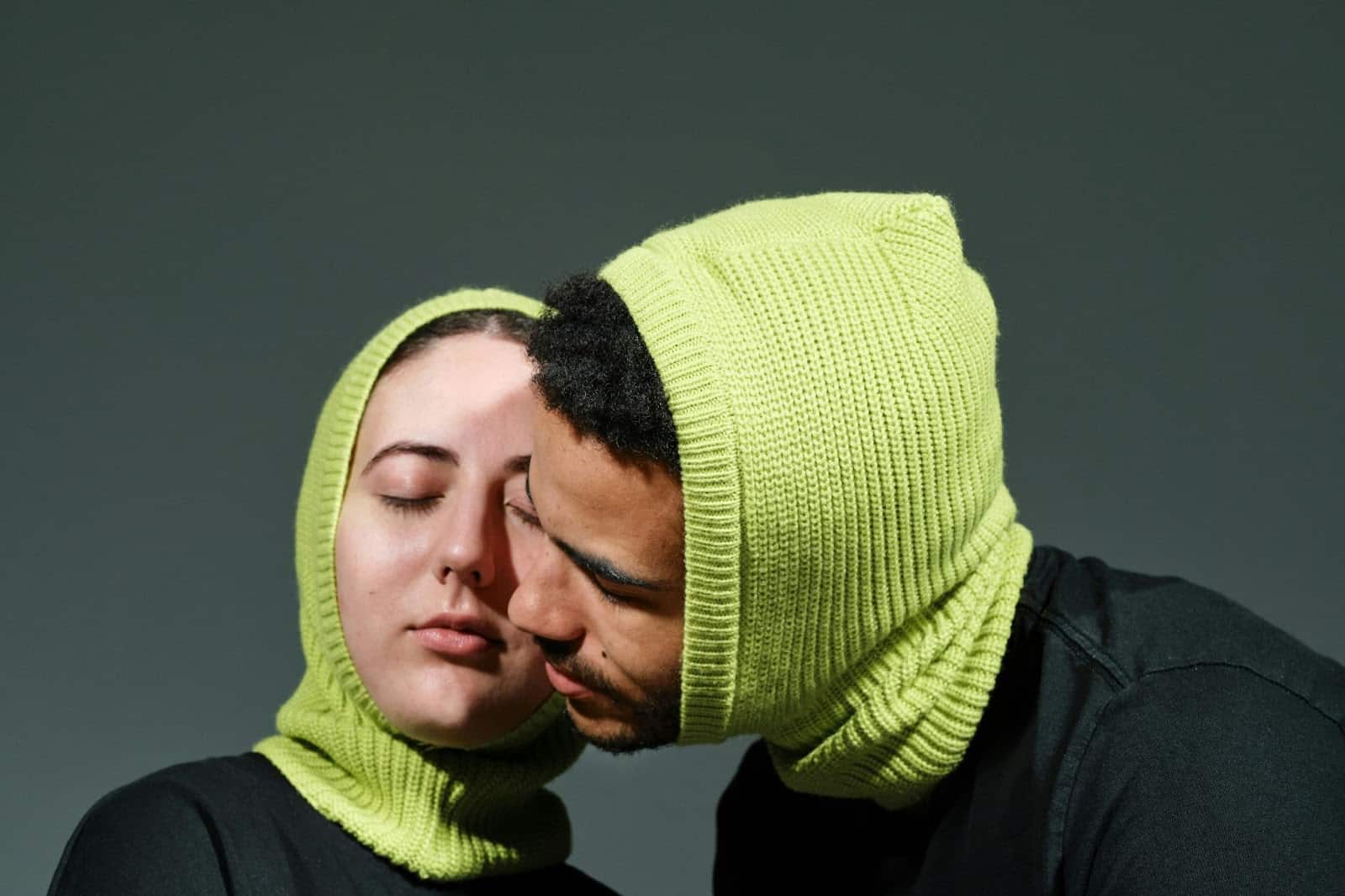 A man and woman being close to each other.