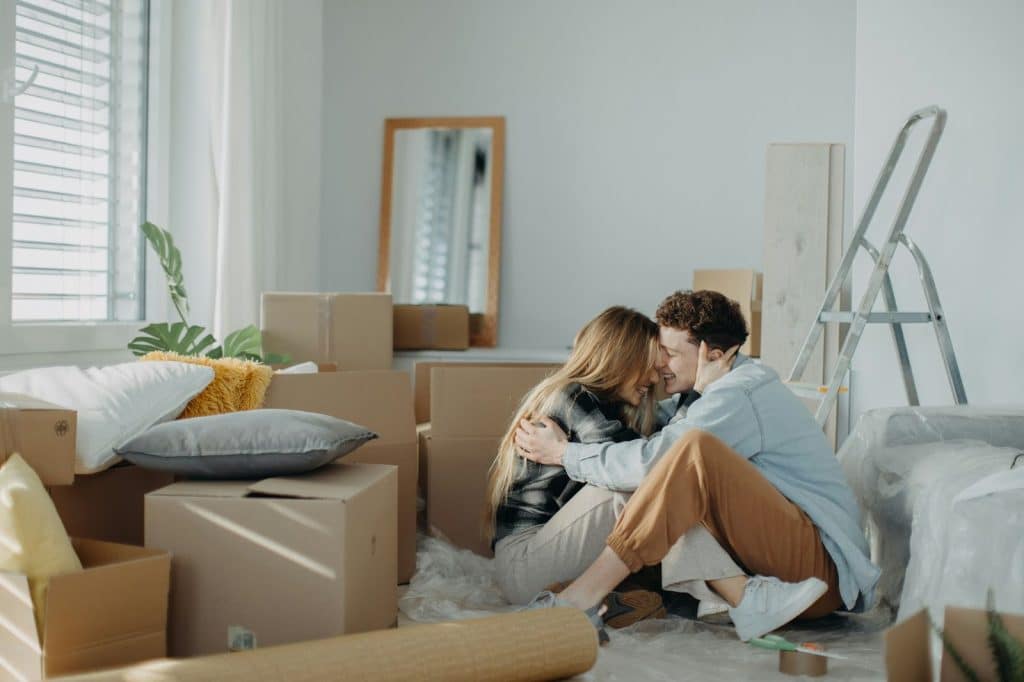 A man and woman planning their future in their apartment.