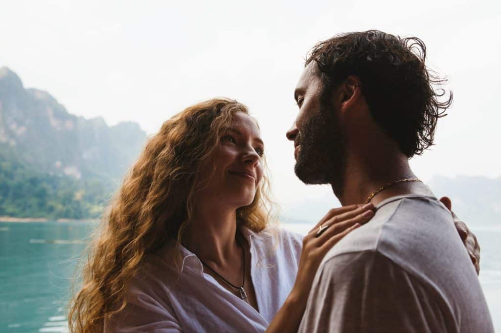 A woman looking at the man.