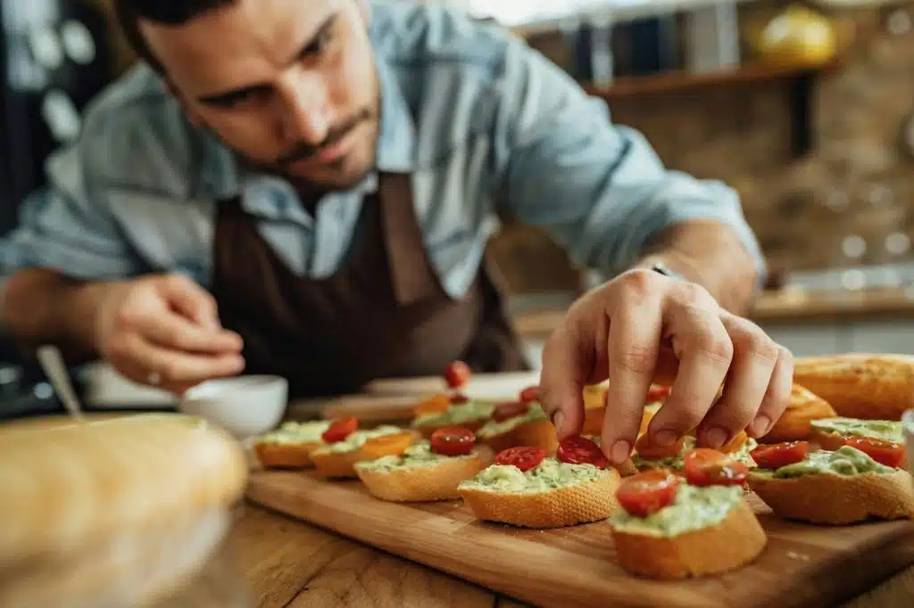 A man making a sandwich.