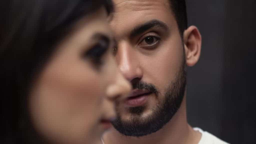 Man venting while woman looks emotionally drained.