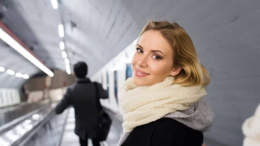Woman looking hopeful while husband walks past distracted.
