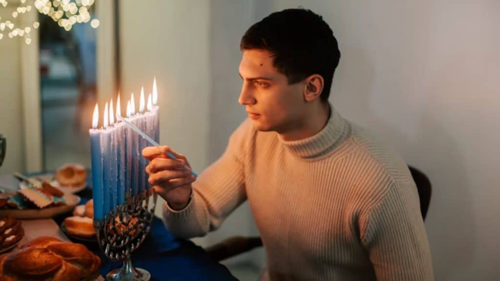 Man planning a surprise candlelit dinner at home.
