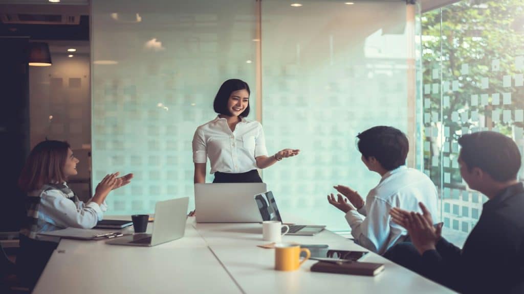 A woman presenting at work.