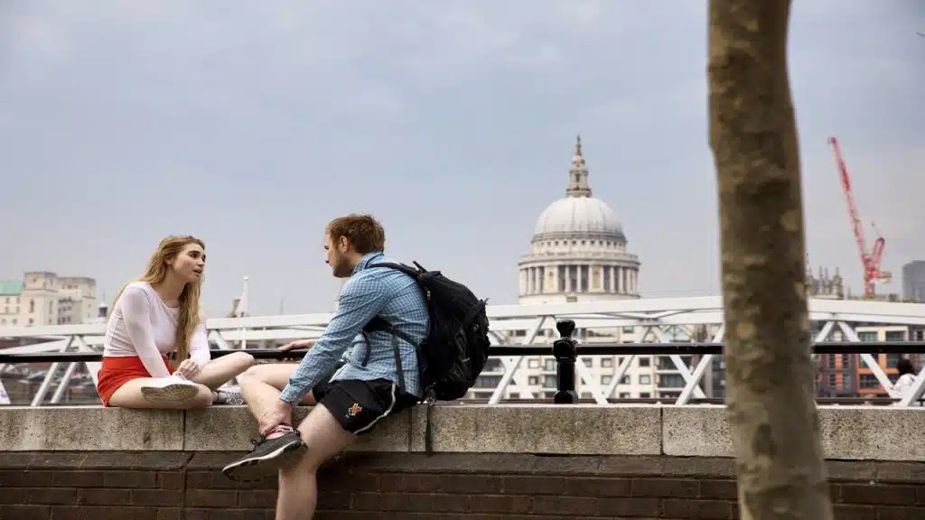 A couple talking outdoors.