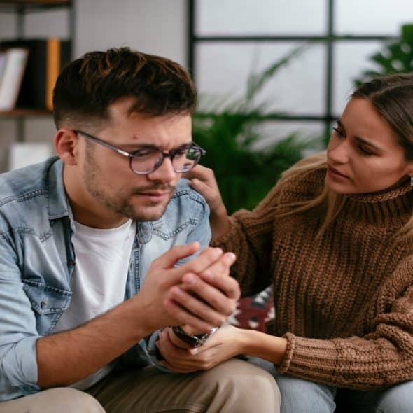 A woman supporting her depressed partner.