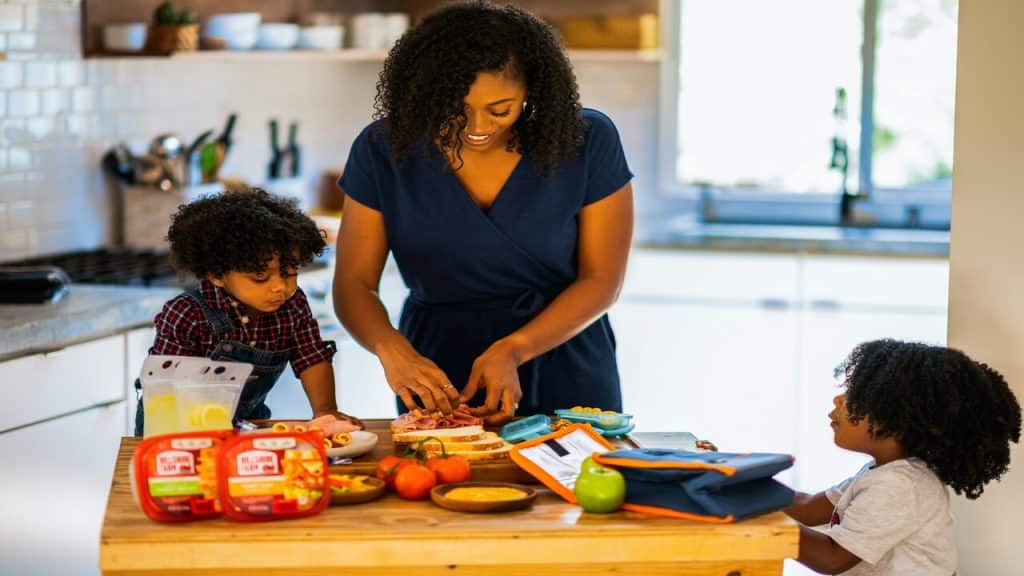 A mom preparing food for her kids.