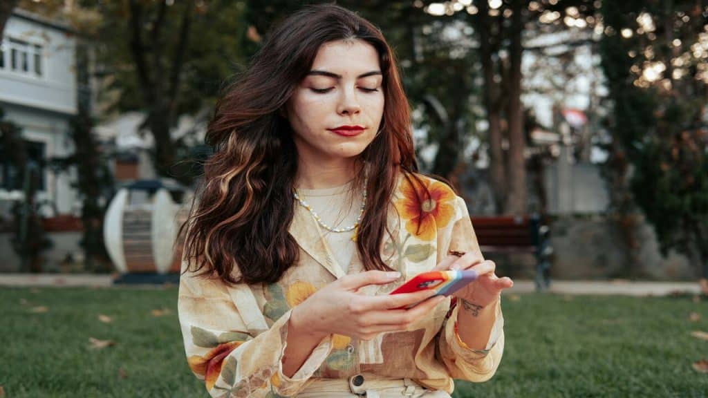 A woman waiting for a text.