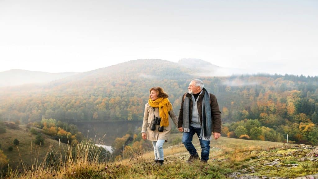 A couple taking a nature walk.