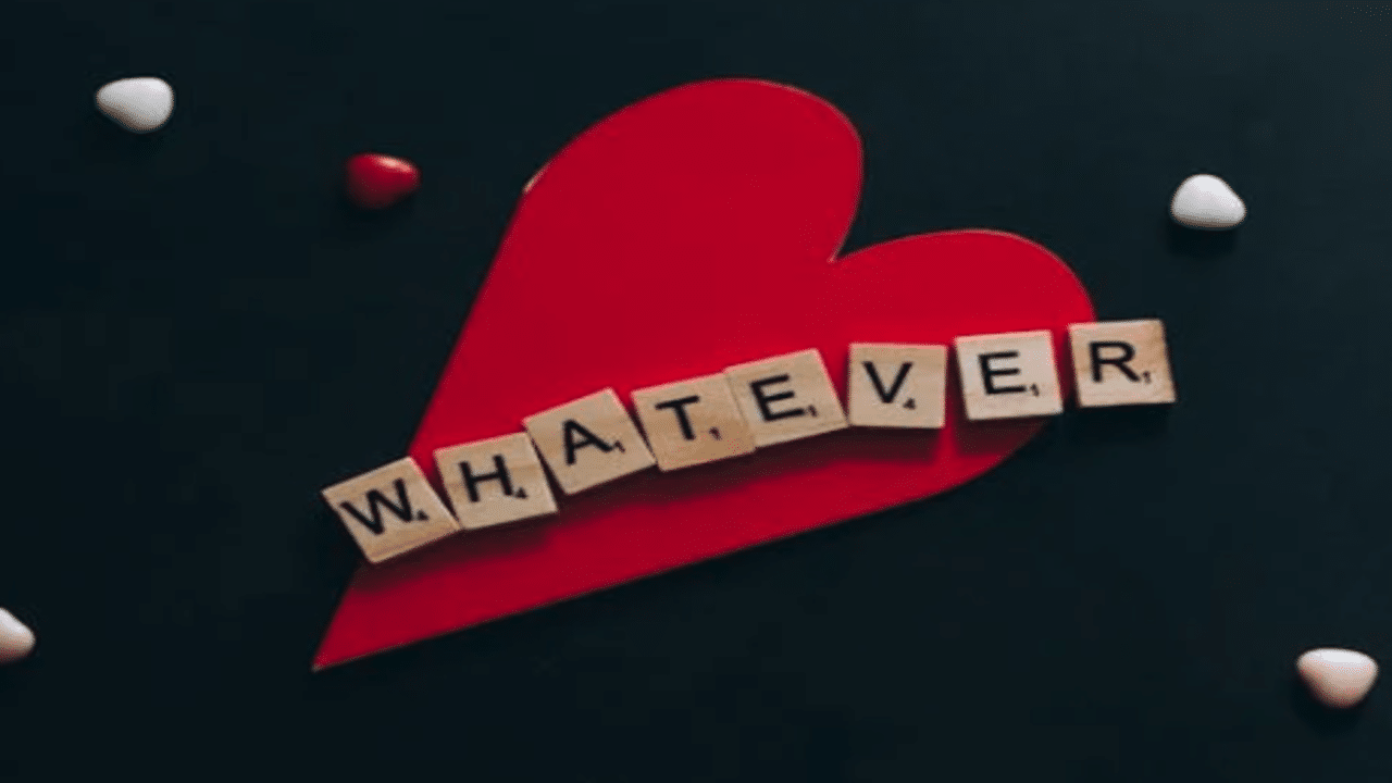 The word “whatever” written in wooden letters