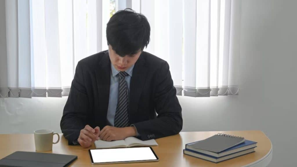 Man reading a self help book