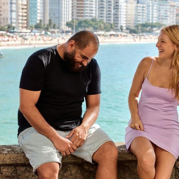 A man and woman laughing together