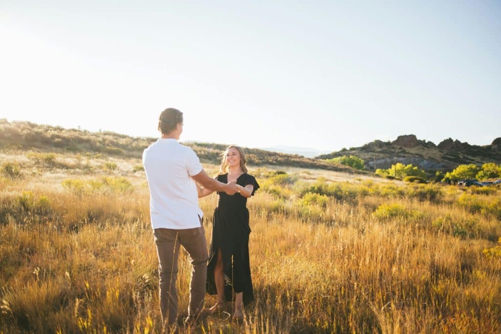 A man and woman at the grass field