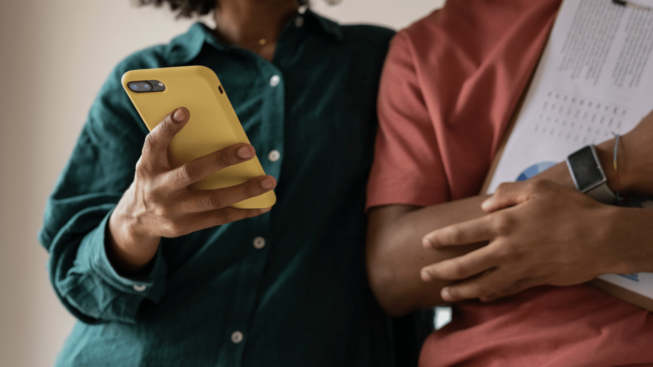 A couple looking at a phone.