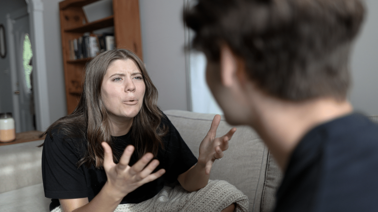 A woman angrily confronting her partner.