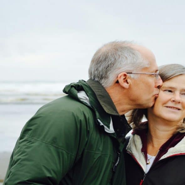 A mature couple by the beach.