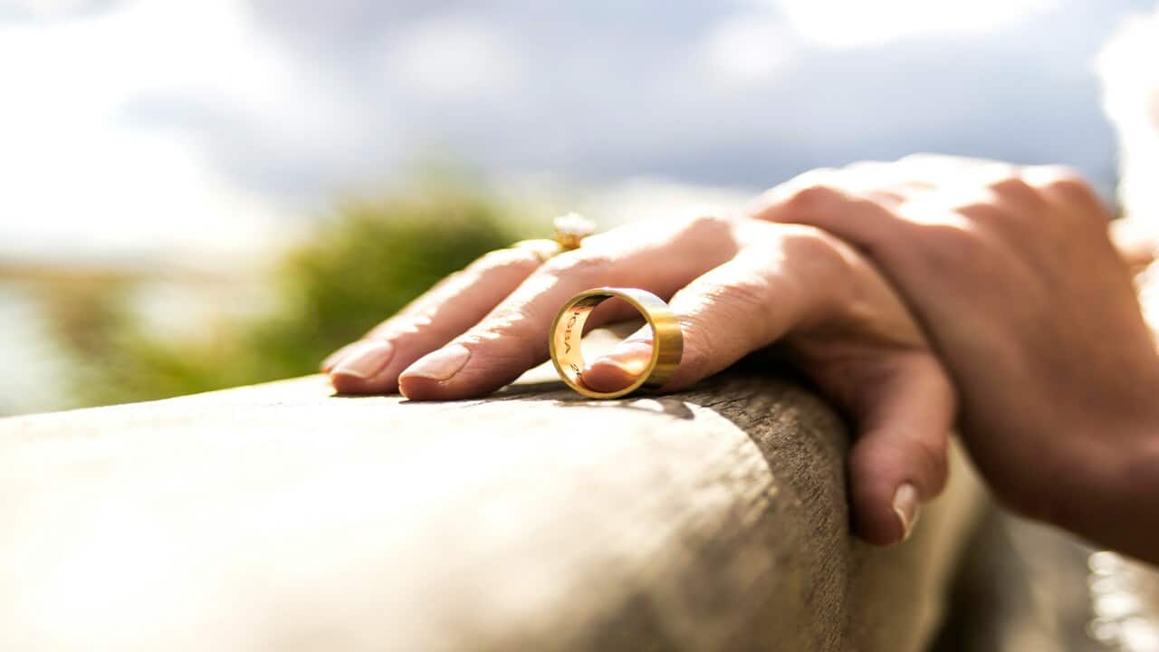 A man removing his wedding band.