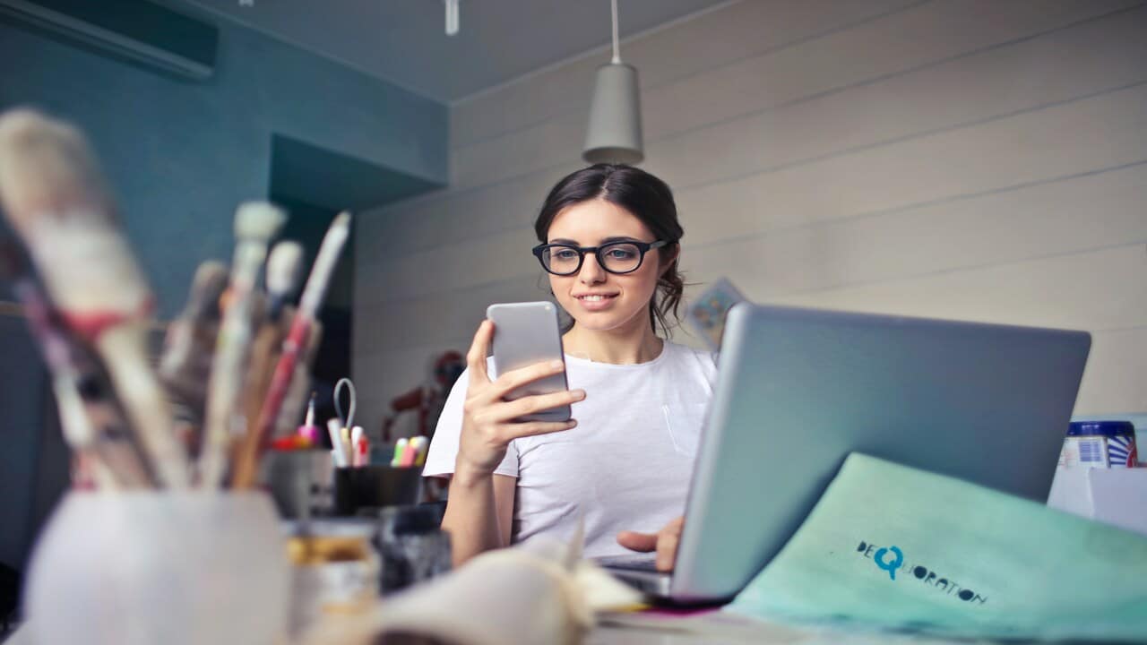 A woman using her phone.