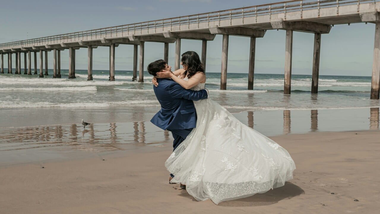 A couple during their beach wedding.