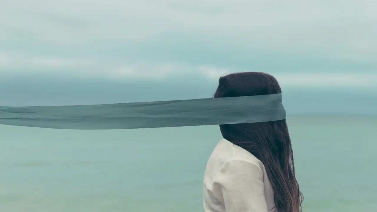 A woman with a blindfold.